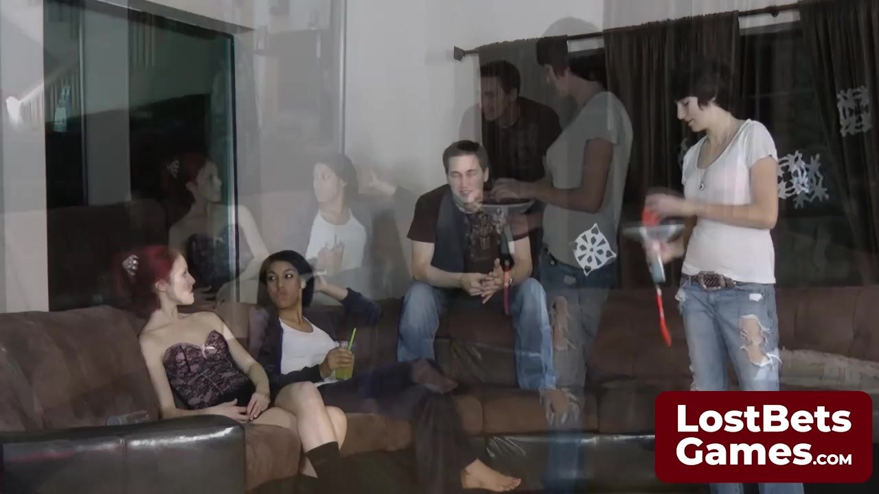 Three friends and one lucky guy playing a strip game in the ...