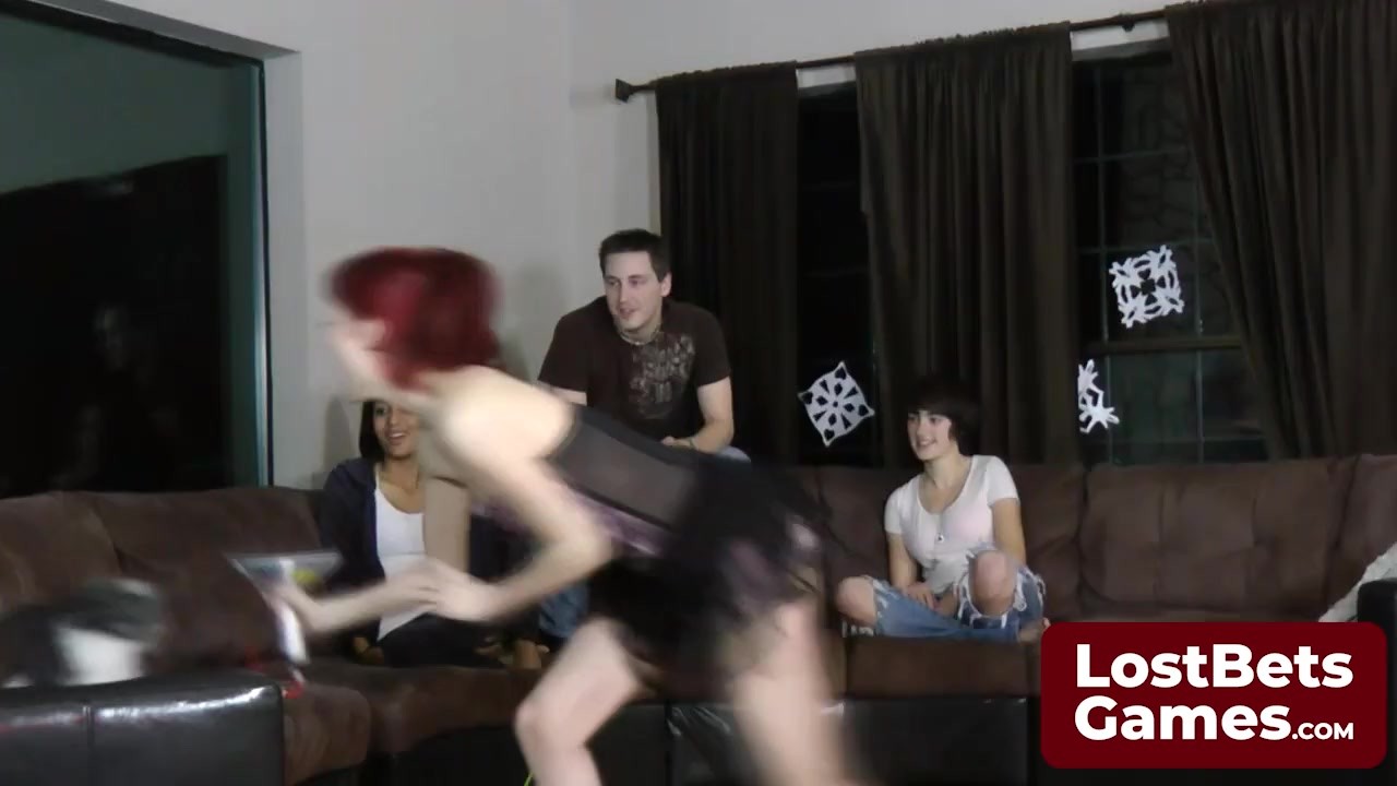 Three friends and one lucky guy playing a strip game in the ...
