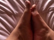 girl with hairy legs plays with her feet 14/16