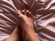 girl with hairy legs plays with her feet 4/16