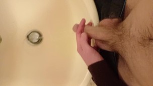 Piss in the sink from my long, floppy, hairy cut cock with balls out