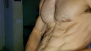 Dark-haired boy with big balls and a very marked sixpack