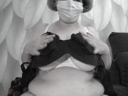 A mature BBW milf with big natural saggy tits tries on bras. 5/16