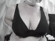 A mature BBW milf with big natural saggy tits tries on bras. 7/16