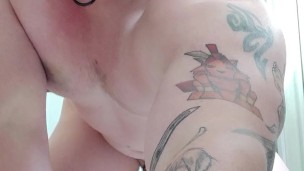 Caged slut rides big dildo