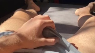 Lubing up my cock and fucking my pocket pussy while enjoying the sunshine ending with a nice load 😈