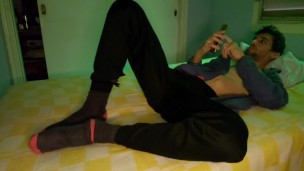 Naked athlete in bed masturbating