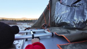 Mountain girl shows off rooftop tent set up and light up butt plug
