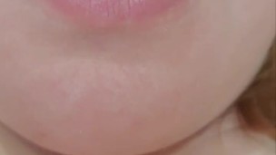 The fat woman plays with her tongue and shows her bush between her legs