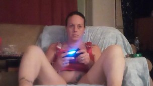Pretty girl smoking cigarette and playing video games, while I film up her mini dress