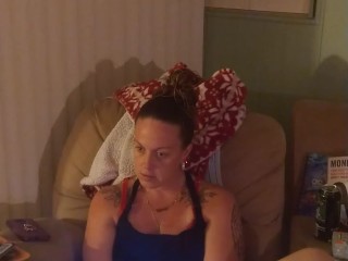 Beautiful girl in black mini dress lifts up her dress and play fortnite while smoking cigarettes