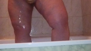 I caught my stepmom in the shower washing and massaging her big ass and her chubby shaved pussy
