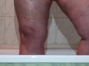I caught a chubby mom playing with her fat pussy in the shower