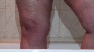 I caught a chubby mom playing with her fat pussy in the shower