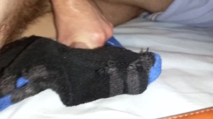 Twink cumming a big load onto some sports socks after gym