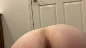 Milf fucks herself from behind