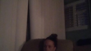 Horny girl in night gown playing video games and showing off her cleavage