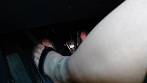 Nylon feet and flip flops in the car