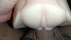Young man touching himself with a toy at home