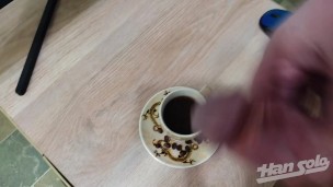 Male jerking off on a cup of coffee with finishing inside
