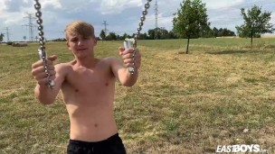 Cute teen blonde boy shows off his abs