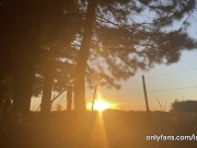 girl peeing with the sunset in the field 15/16