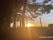 girl peeing with the sunset in the field 16/16
