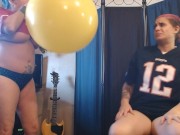 Lesbians Blowing up Big Yellow Balloon Superbowl Party Prep