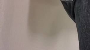 Femboy tries on women's blouse and skirt in store fitting room