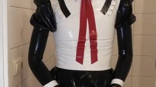 Latex maid uniform dress with black rubber skirt, red bow, frilly stockings and mask wetsuiterest