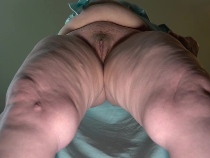 Under the skirt is a hairy pussy of a mature granny, a fat milf.