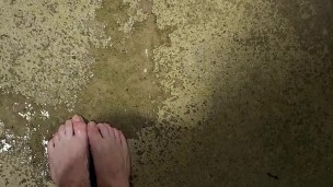 Messy long feet pee outdoors