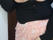 A busty wife is horny, shaking her ass and touching her pussy, remembering her lover's huge cock.