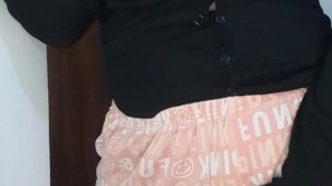 A busty wife is horny, shaking her ass and touching her pussy, remembering her lover's huge cock.