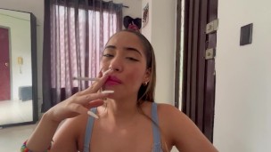 sexy blonde smoking cigarette and sucking big dick