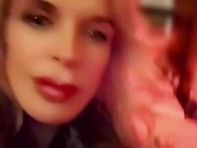 Hot blonde milf sexily sucks a lollipop in front of everyone in a cafe 1/16