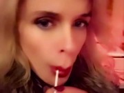 Hot blonde milf sexily sucks a lollipop in front of everyone in a cafe 14/16