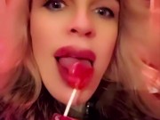 Hot blonde milf sexily sucks a lollipop in front of everyone in a cafe 15/16