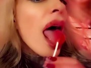 Hot blonde milf sexily sucks a lollipop in front of everyone in a cafe 8/16