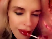 Hot blonde milf sexily sucks a lollipop in front of everyone in a cafe 9/16