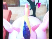 Cosplay girl has fun with a pink inflatable unicorn 15/16