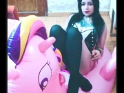 Cosplay girl has fun with a pink inflatable unicorn 3/16
