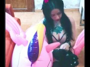 Cosplay girl has fun with a pink inflatable unicorn 4/16