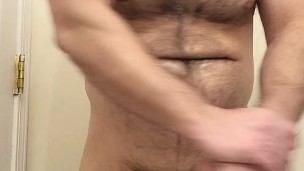 Hairy muscle bear flexing after cumshot