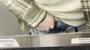 young twink jerks off his cock in a train toilet
