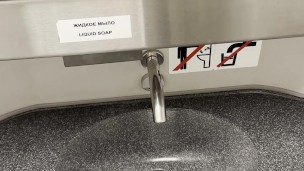 young twink jerks off his cock in a train toilet