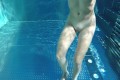 Nude teen with amazing tits in a public pool makes small dick hard