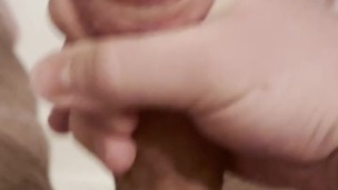 young twink actively jerks off his dick in the morning (close-up)