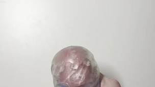 young twink actively jerks off his cock with a masturbator