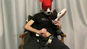young guy jerks off a thick cock and sniffs shoes